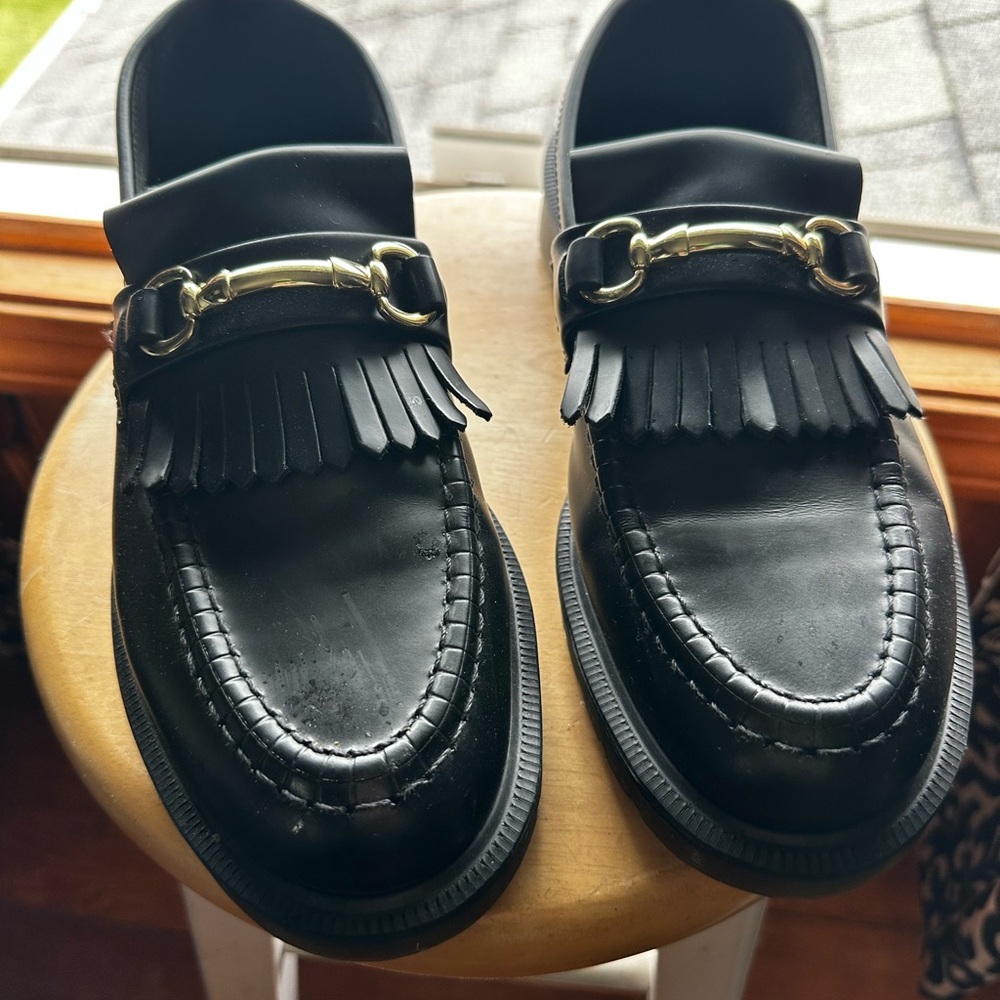 Size 9 dr.Martin’s with gold detailed buckle. Worn twice only. Very new.